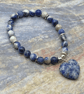 Sodalite stone stretchy bracelet with silver plated heishi beads - Image 1
