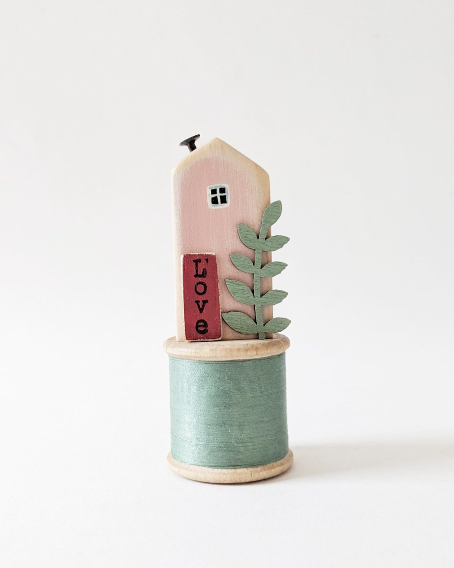 Image of Little Wooden House on a Vintage Bobbin 'Love' 