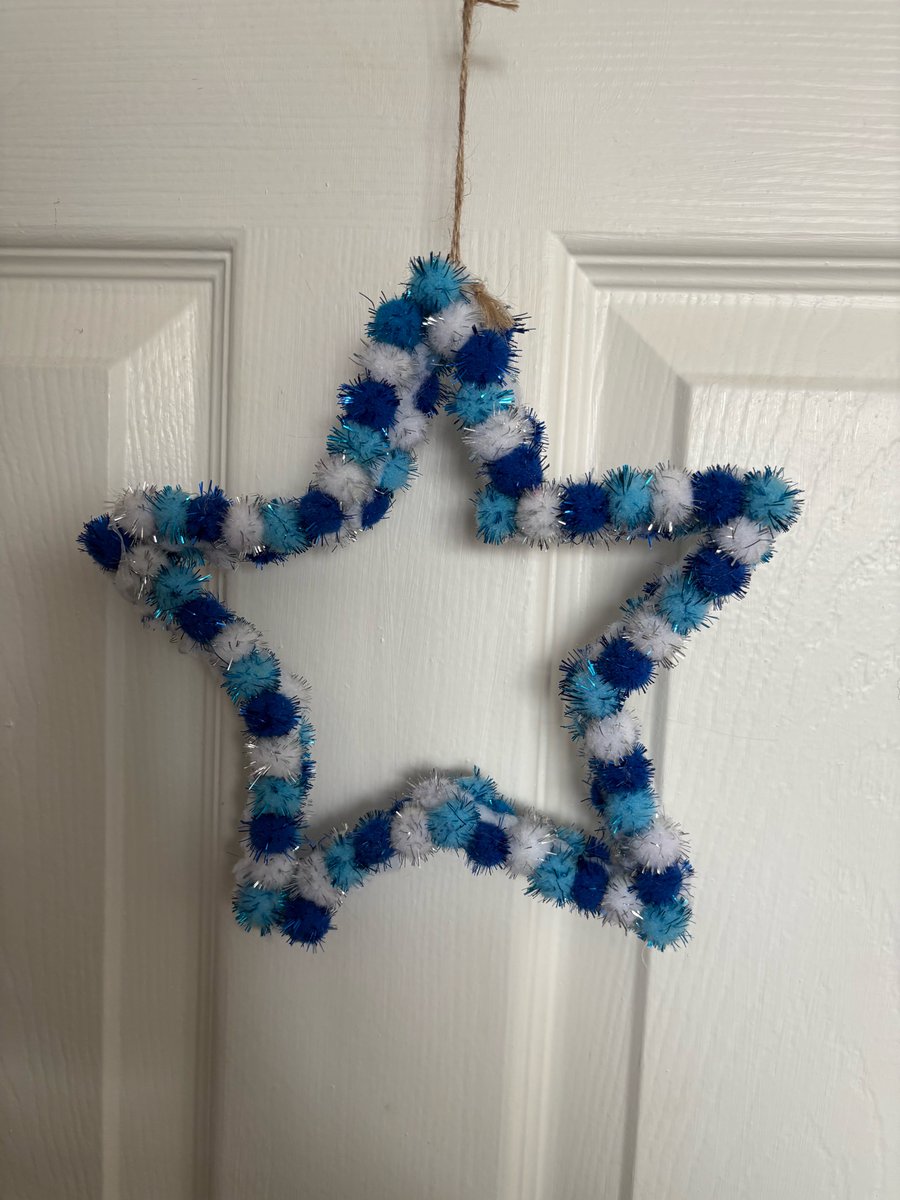 Blues and whites glitter Pom Pom star. 