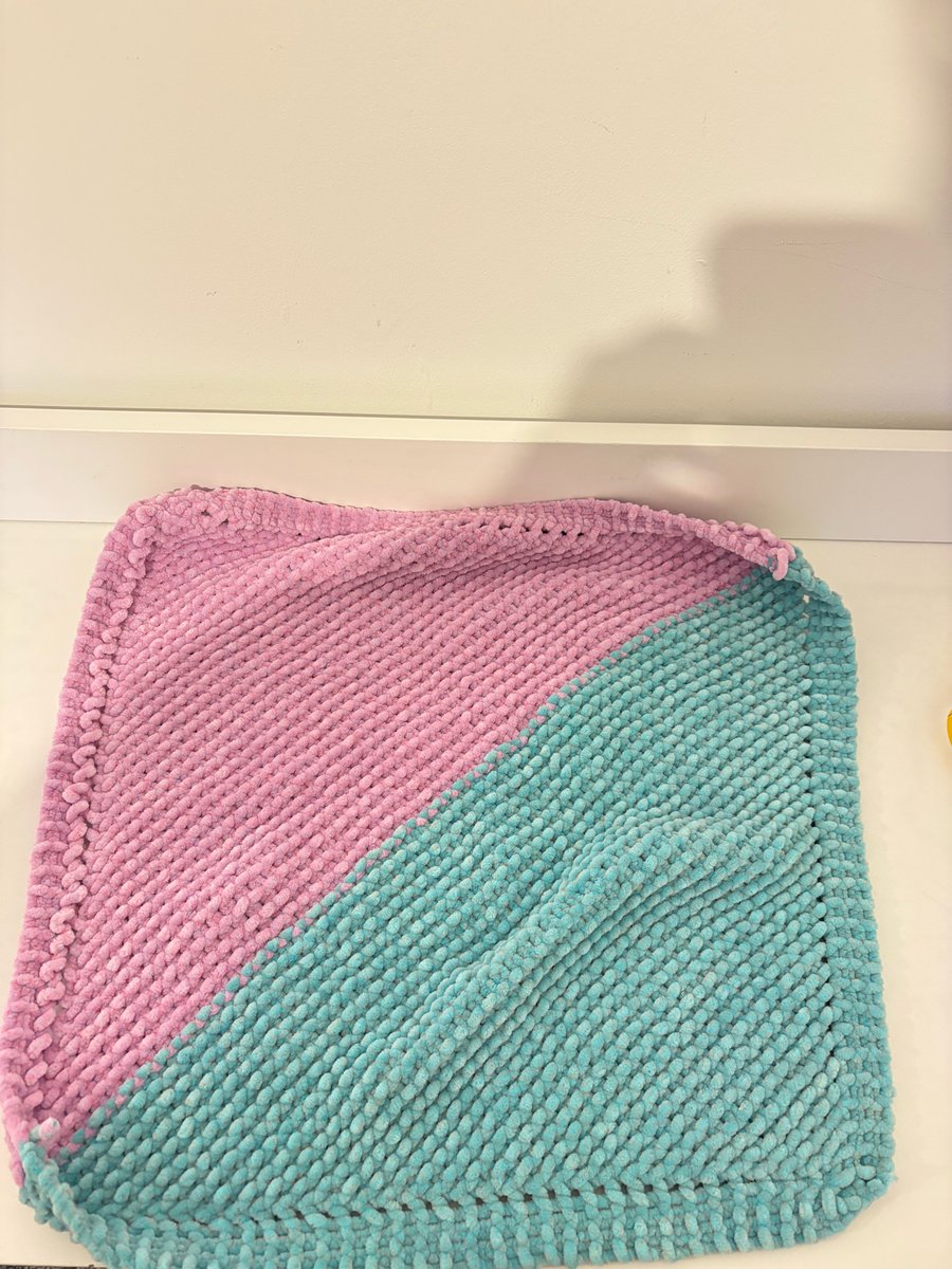Hand knit baby blanket. 