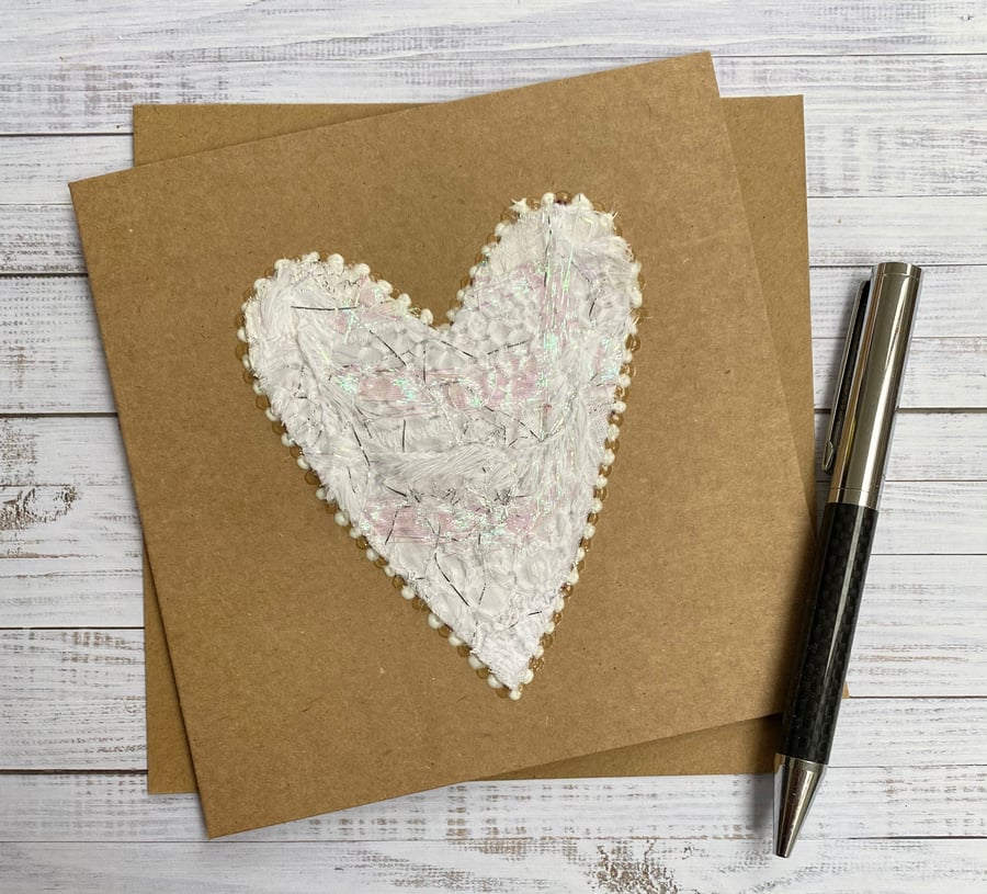 Up-cycled white and silver embroidered heart card. 