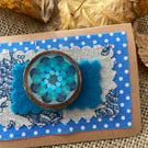 Wooden brooch with wavy flowers 