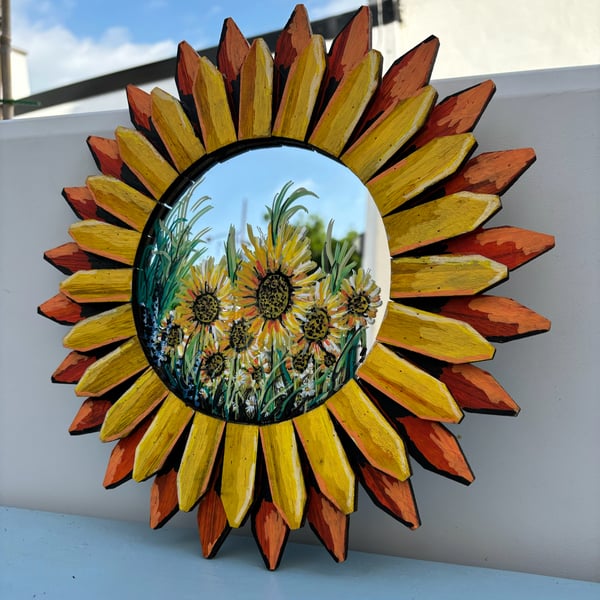 A hand painted Wood framed mirror by Andrew Jenkins 