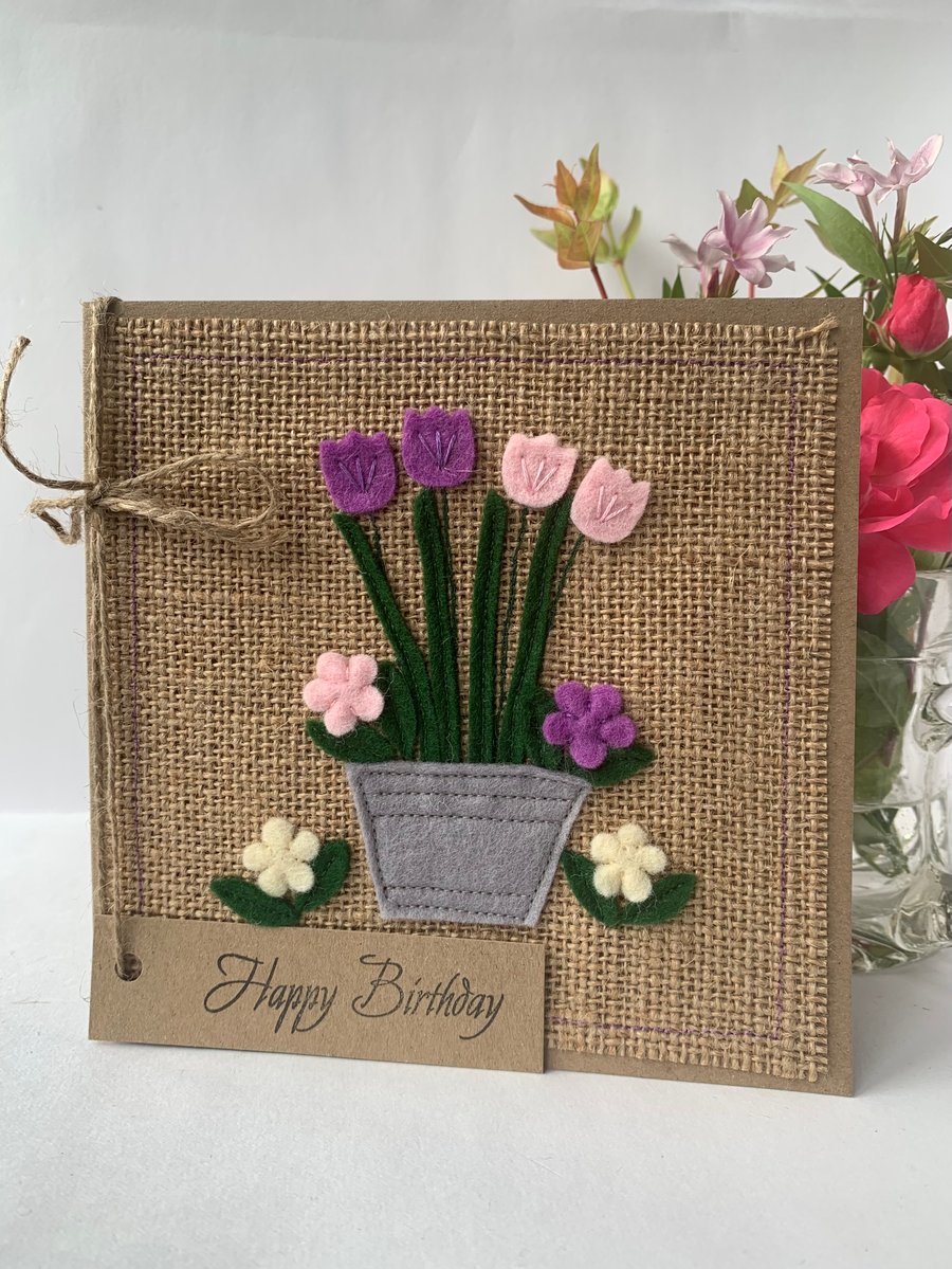 Handmade Birthday Card. A pot of purple and pink flowers from wool felt.