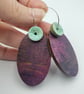 Oval shaped earrings in burgundy with a mint button bead - Image 1