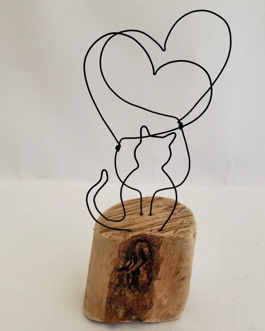 'We love our cat' driftwood and wirework.