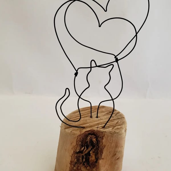 'We love our cat' driftwood and wirework.