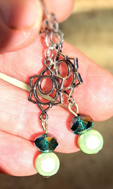 Lovely pair of dangle silver plated earrings, disco bead and the lotus flower