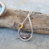 Silver sea mountains hills pendant with amber sun