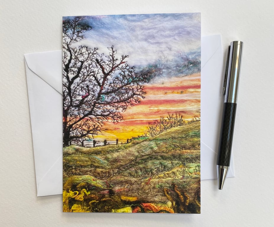 Sunrise over a hill with tree printed card.