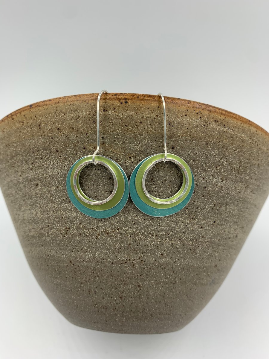 Large 'Ripples' circle earrings in teal and lime with recycled silver ring