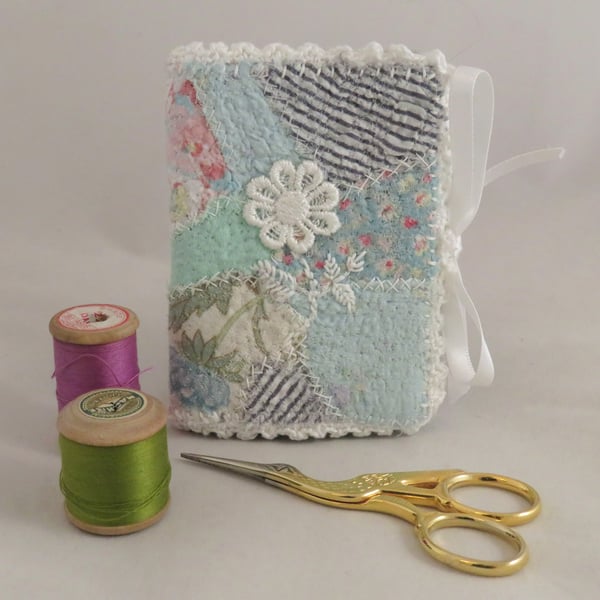 Needlebook from embellished vintage fabric scraps