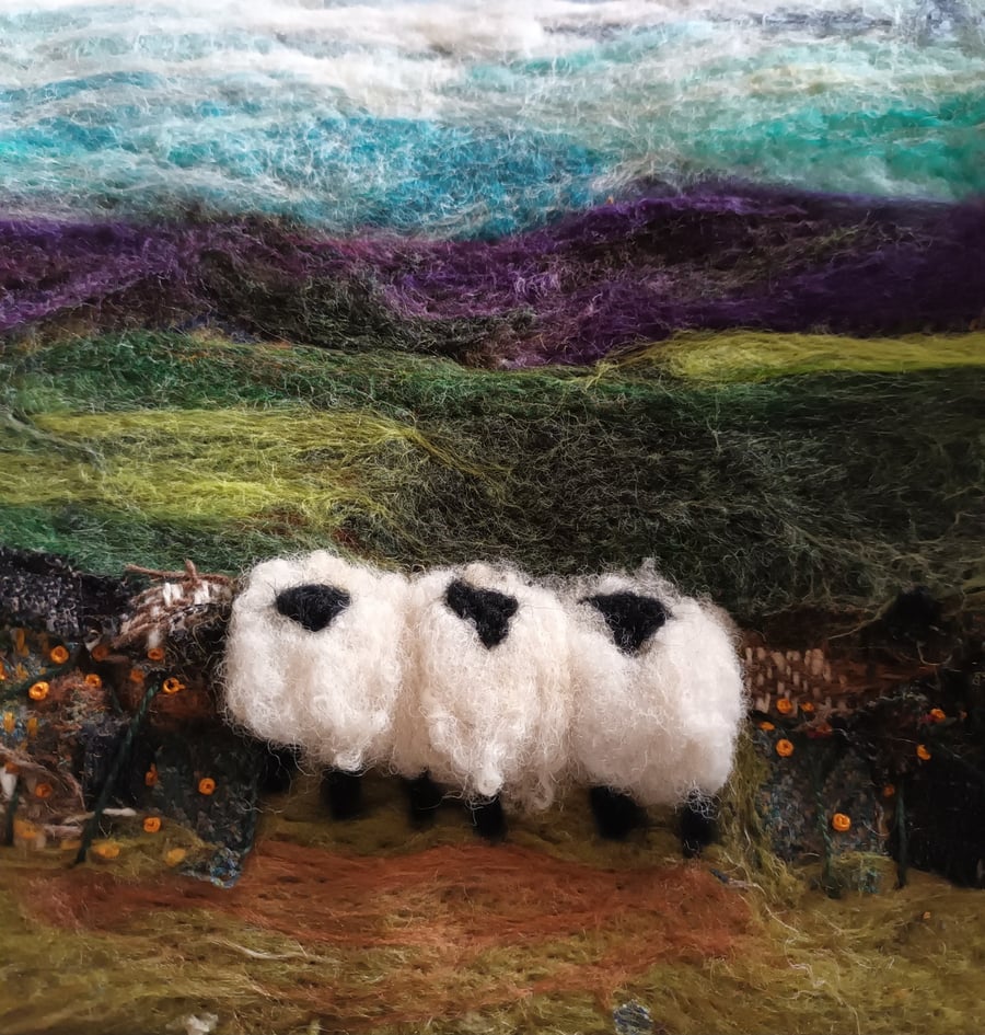 Sheep by a dry stonewall wool painting.  Needlefelt picture with hand embroidery
