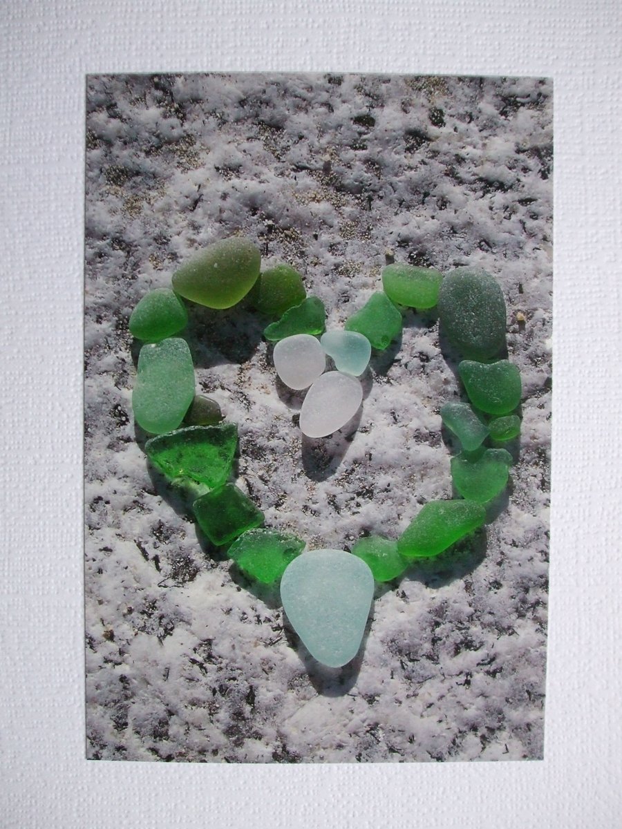 Portrait photographic card of a heart shape in sea glass.