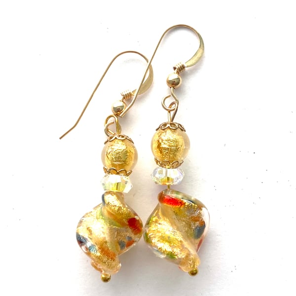 Murano glass gold twist earrings with Swarovski crystal and gold fill wires.