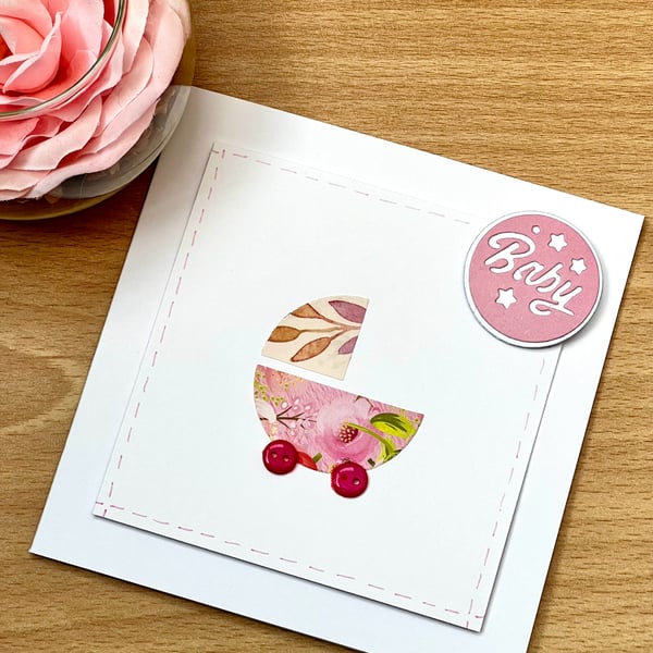 ‘New baby girl, pink wheels’ Card