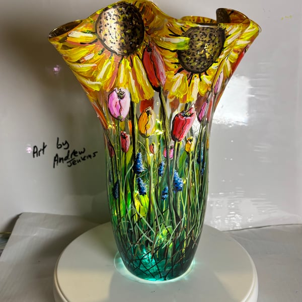 A large hand painted and fired fluted glass vase by Andrew Jenkins 