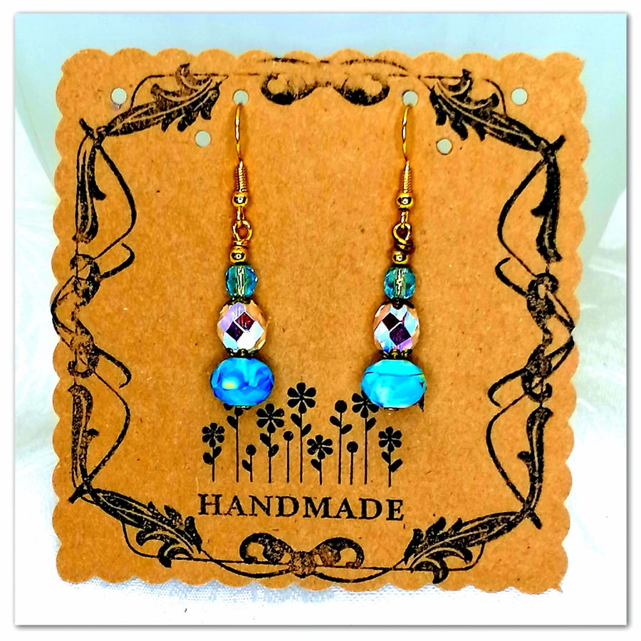 Handmade blue glass bead earrings with clear iridescent crystal beads