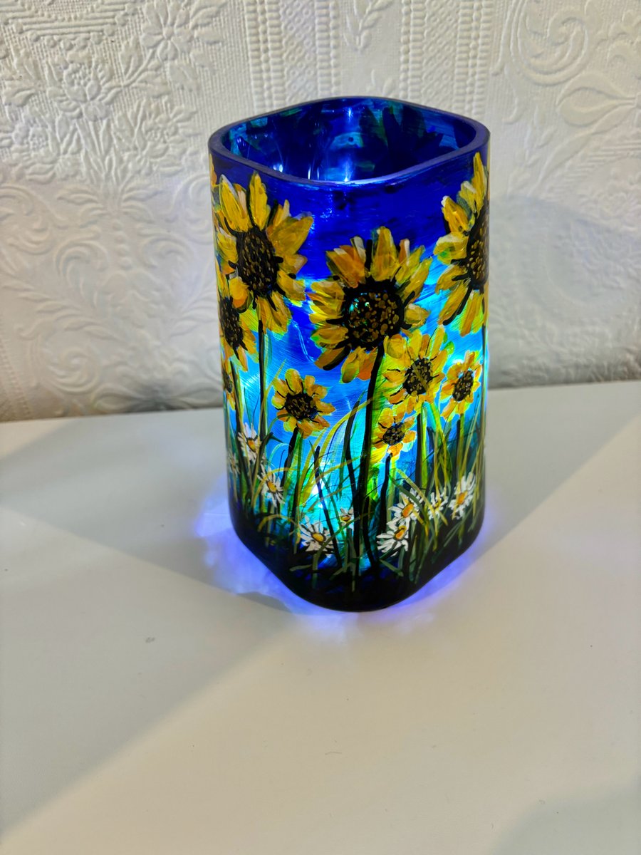 A hand painted and fired glass vase by Andrew Jenkins 