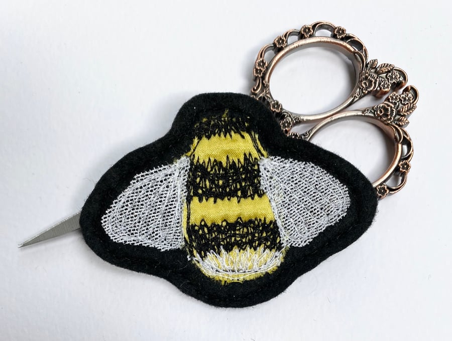 Embroidered bumblebee brooch pin of badge. 