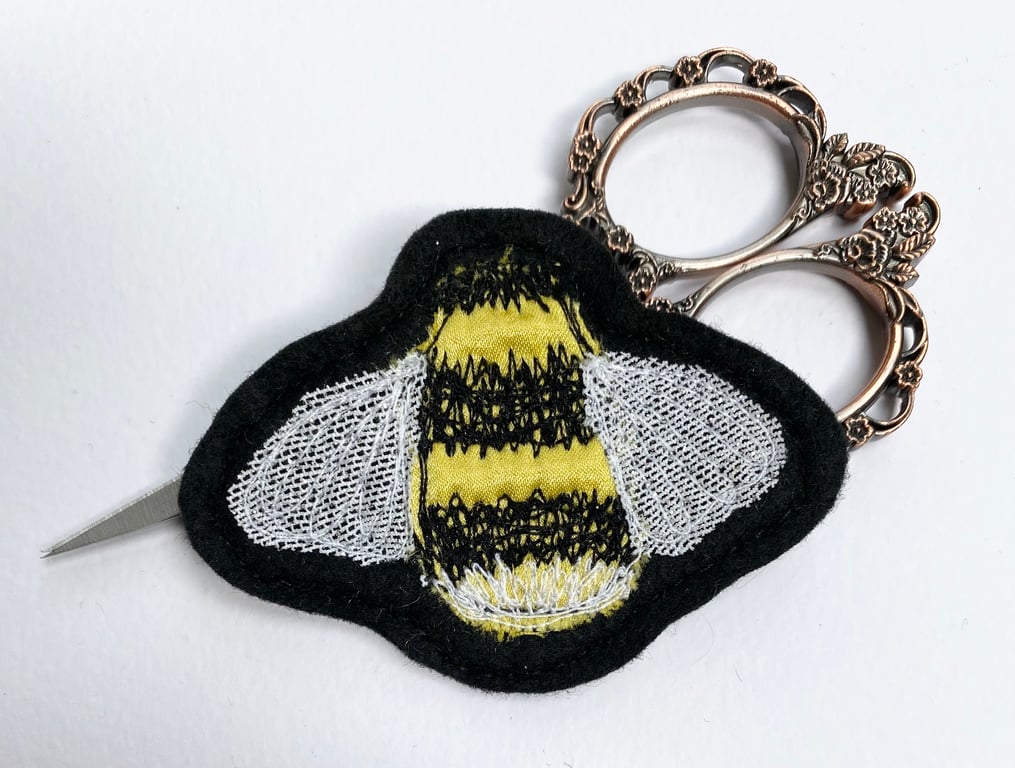 Embroidered bumblebee brooch pin of badge. 