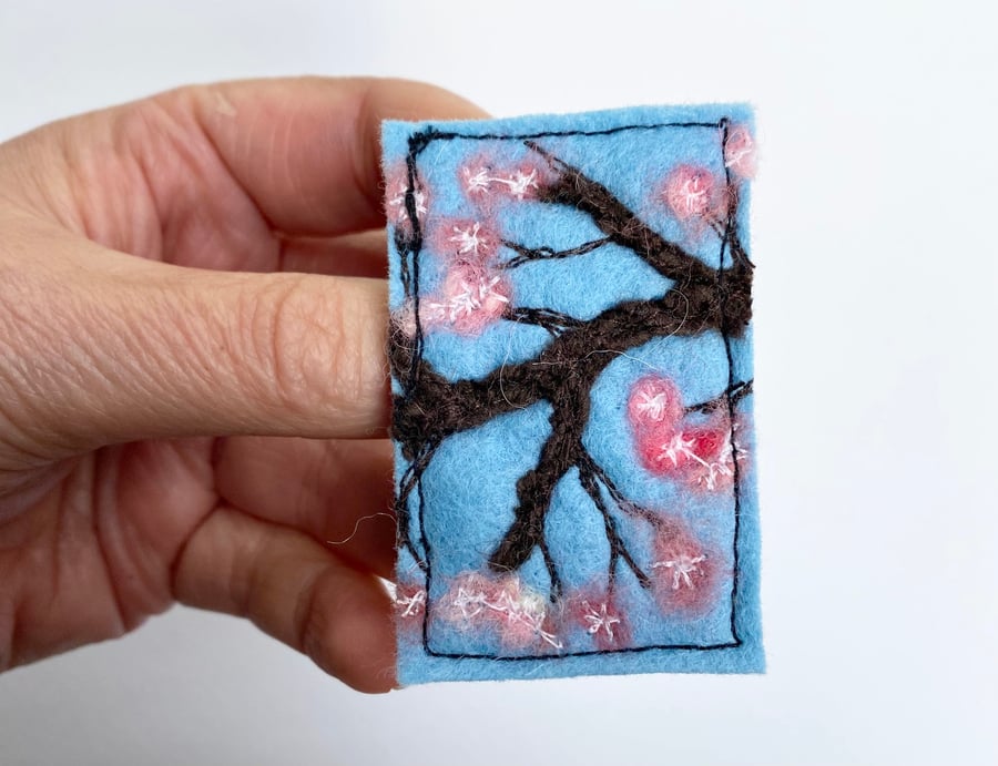 Embroidered cherry blossom brooch pin of badge. 