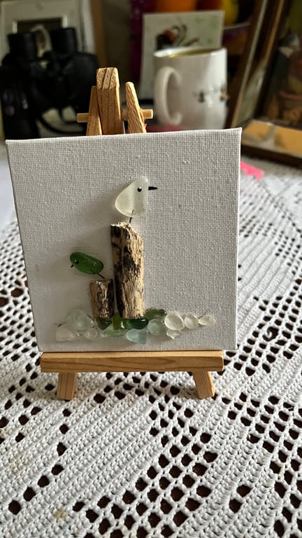 Seaglass seagull picture on an easel . Flock on the Dock 