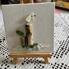 Seaglass seagull picture on an easel . Flock on the Dock 