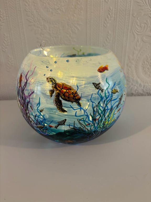 A hand painted and fired glass globe vase by Andrew Jenkins 