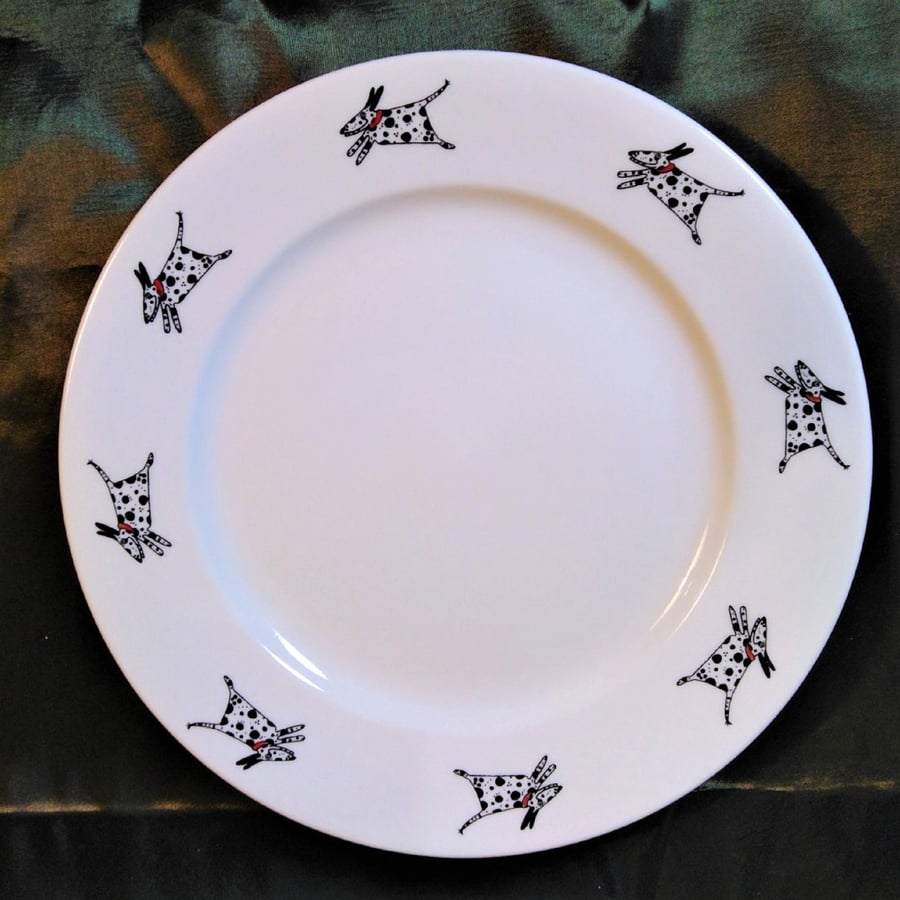 Dalmatians running around a medium size side plate twenty one centimetres wide w