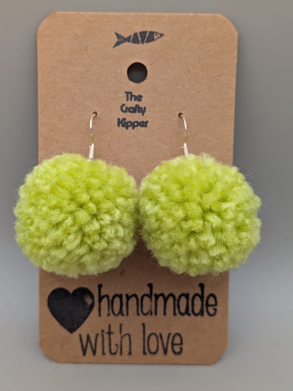 Handmade lime green pom pom dangle earrings.