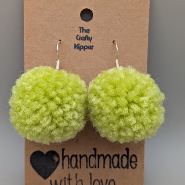 Handmade lime green pom pom dangle earrings.