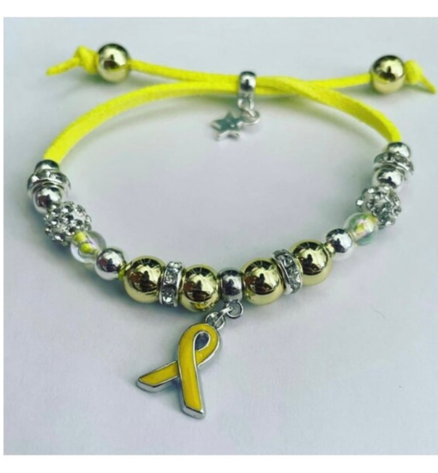 Yellow ribbon charm suede effect corded adjustable fit bracelet in awareness