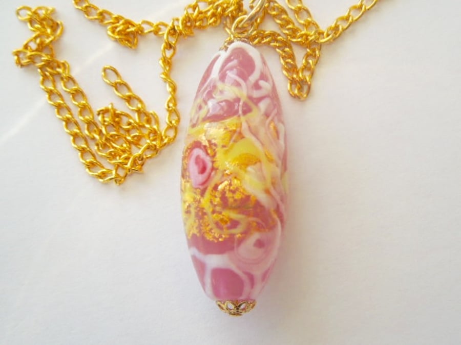 Pink and gold Murano glass pendant.