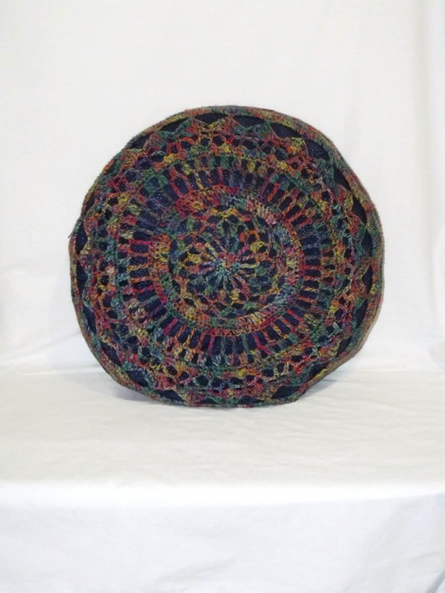 multicoloured crocheted mandala scatter cushion, big circular blue throw pillow