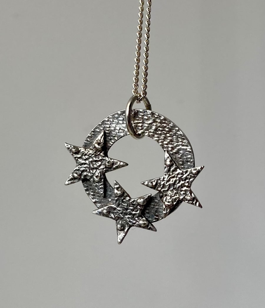 Silver circle with 3 stars, handmade in pure silver. 