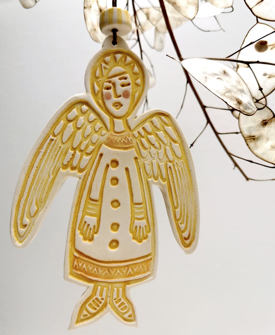 Ceramic Angel Christmas decoration in deep yellow
