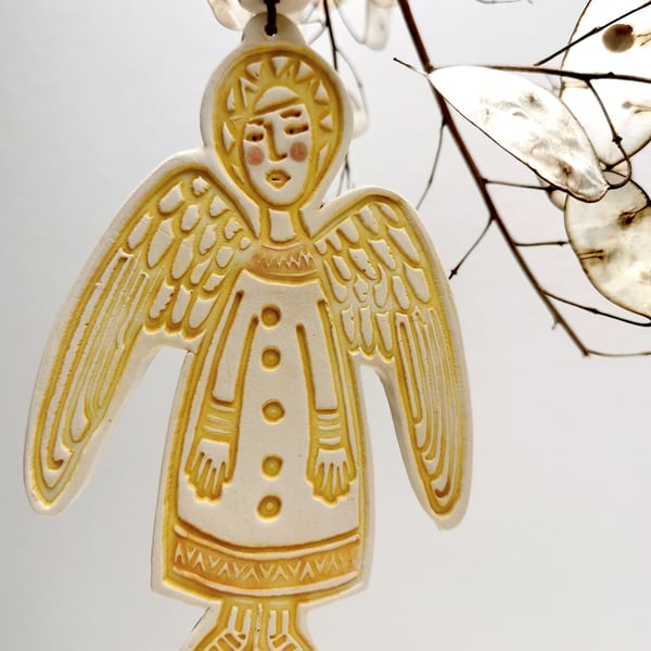 Ceramic Angel Christmas decoration in deep yellow