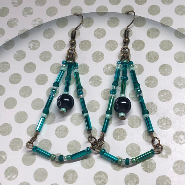 Long teal glass chandelier earrings