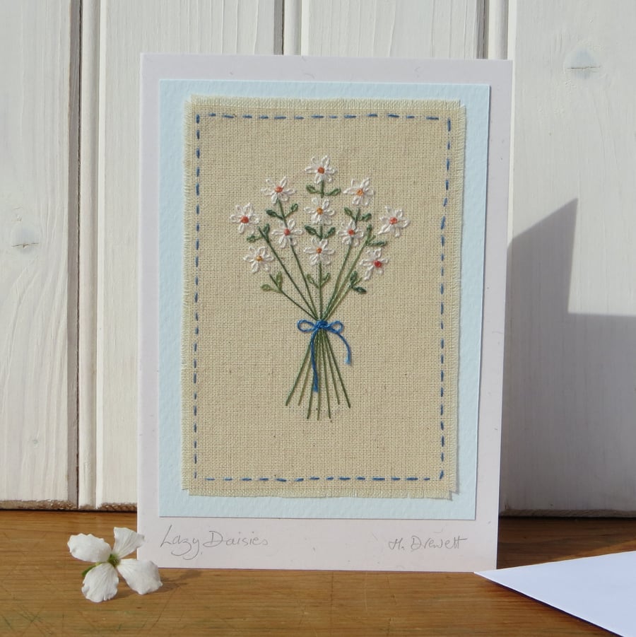 Lazy Daisies hand embroidered card with finely worked daisies and bow