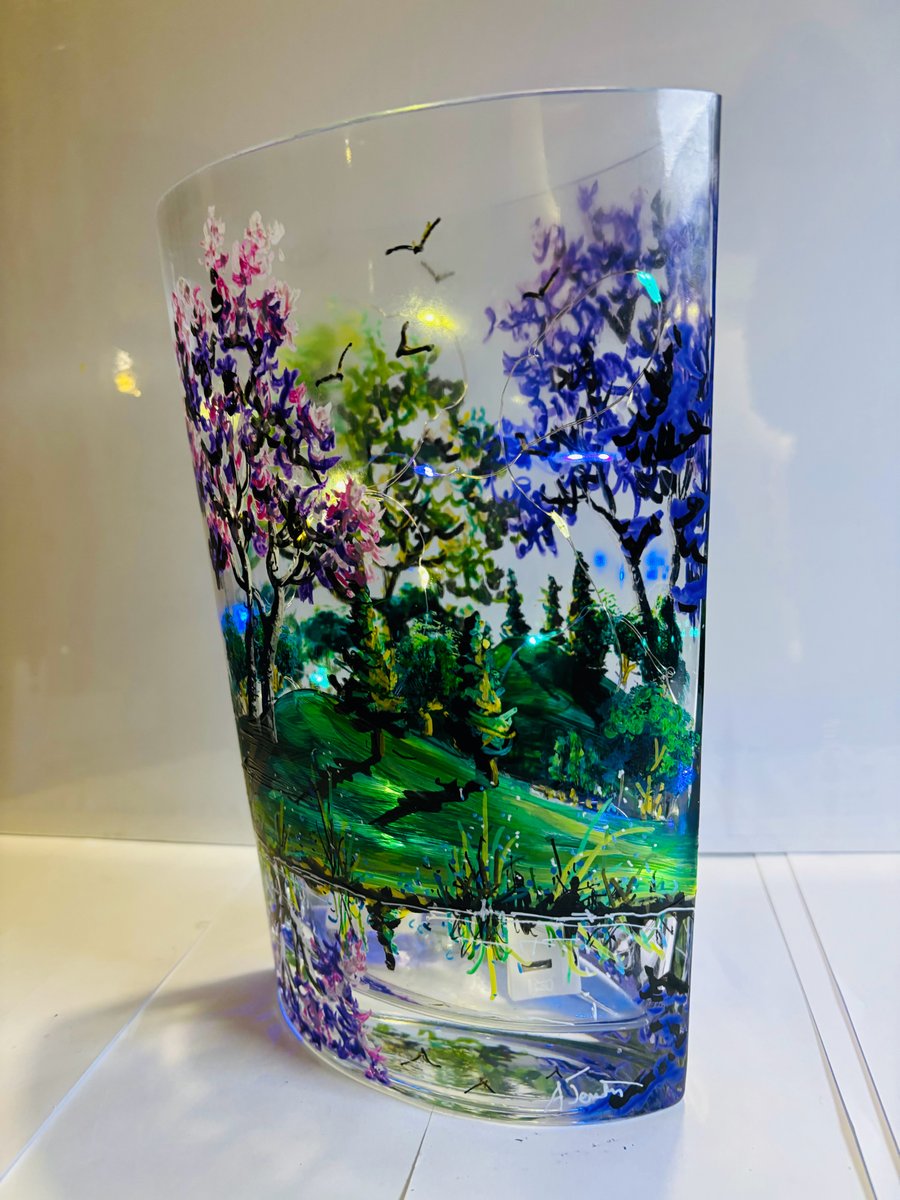 A hand painted and fired glass vase by Andrew Jenkins