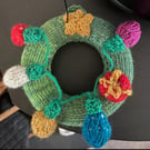 Mini knitted Christmas wreath