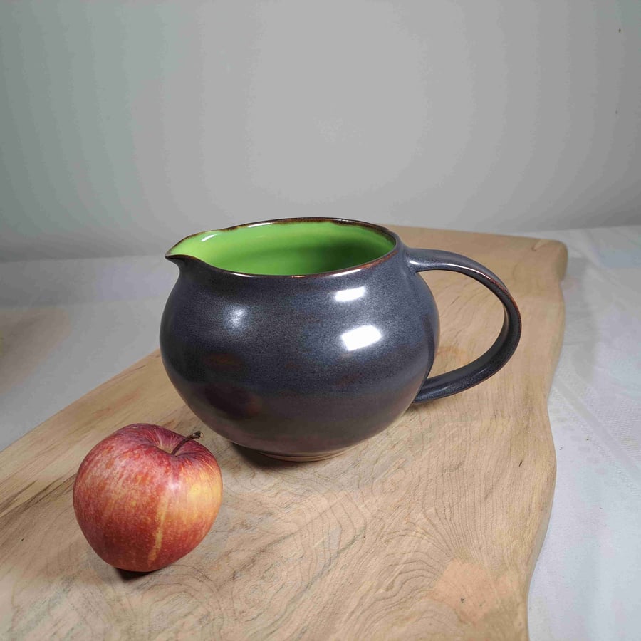 LIME GREEN CERAMIC JUG - with a charcoal exterior