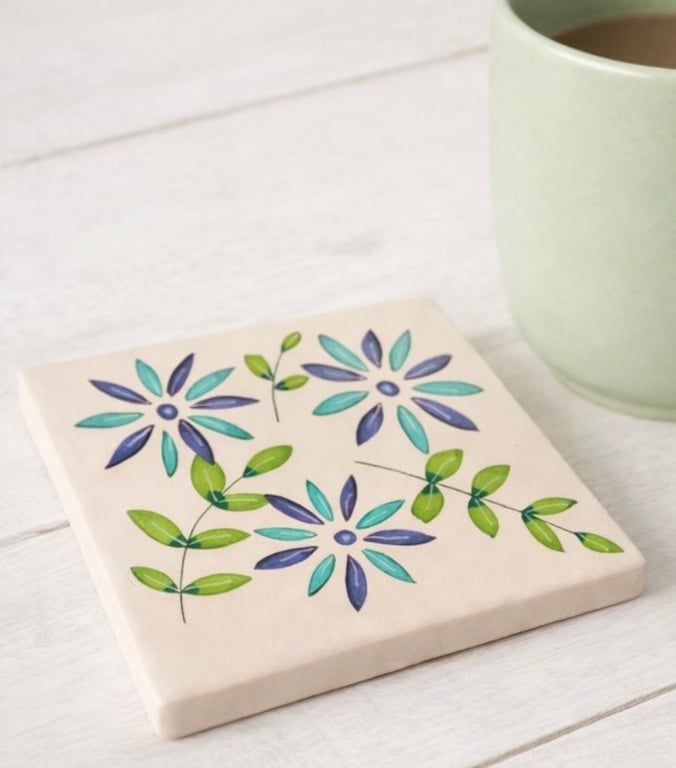 Ceramic coaster with hand drawn design 