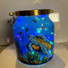 A hand painted and fired brass and glass lantern by Andrew Jenkins 