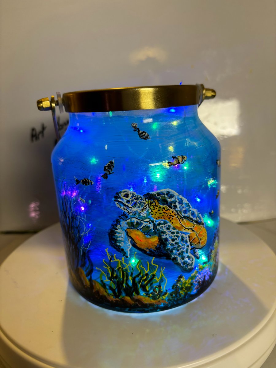 A hand painted and fired brass and glass lantern by Andrew Jenkins 