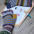 Whimsical mismatched handknitted wristwarmers