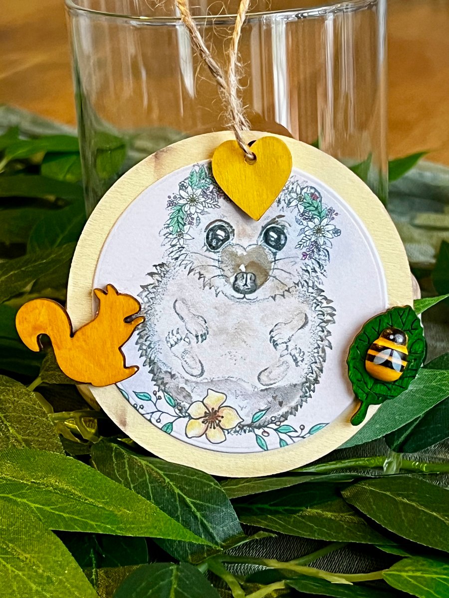 ‘Wooden hanging decoration’ - Artists Illustration of a hedgehog with bee