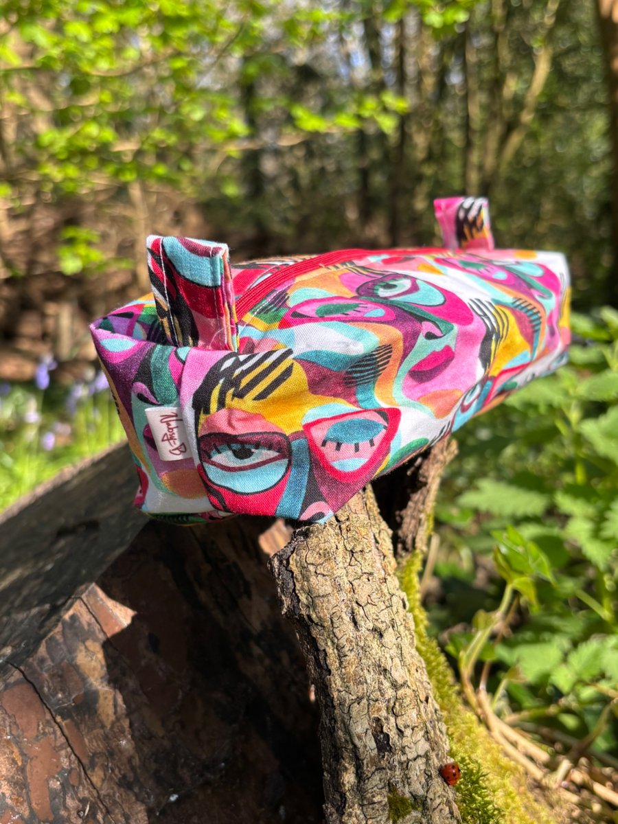 Makeup bag (small) in multicoloured abstract face print