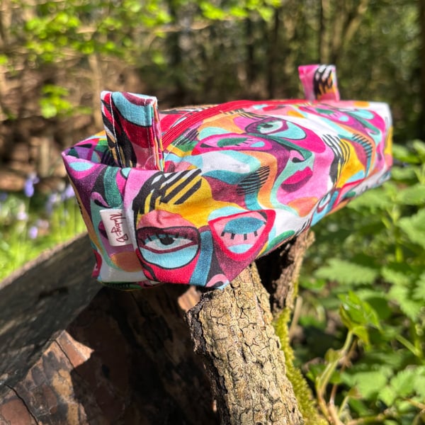 Makeup bag (small) in multicoloured abstract face print